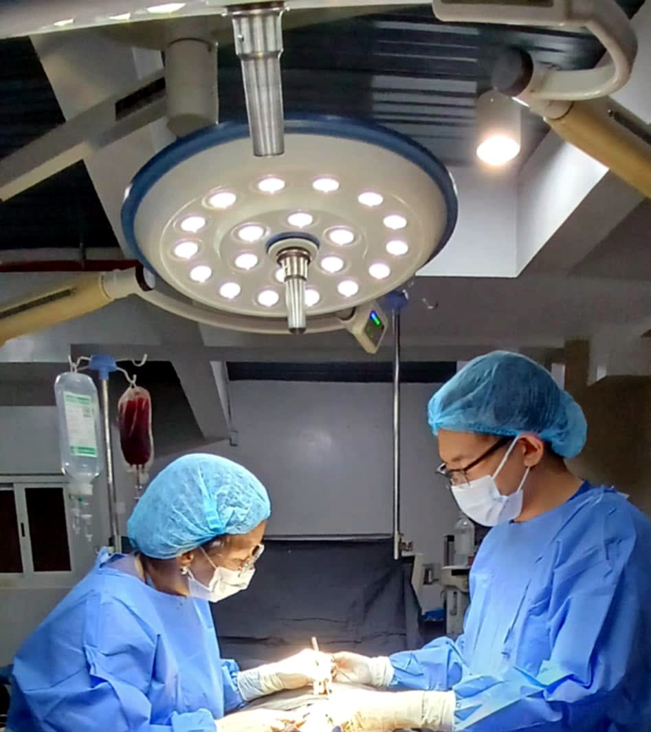 Holylife surgeons operating under the OR lights