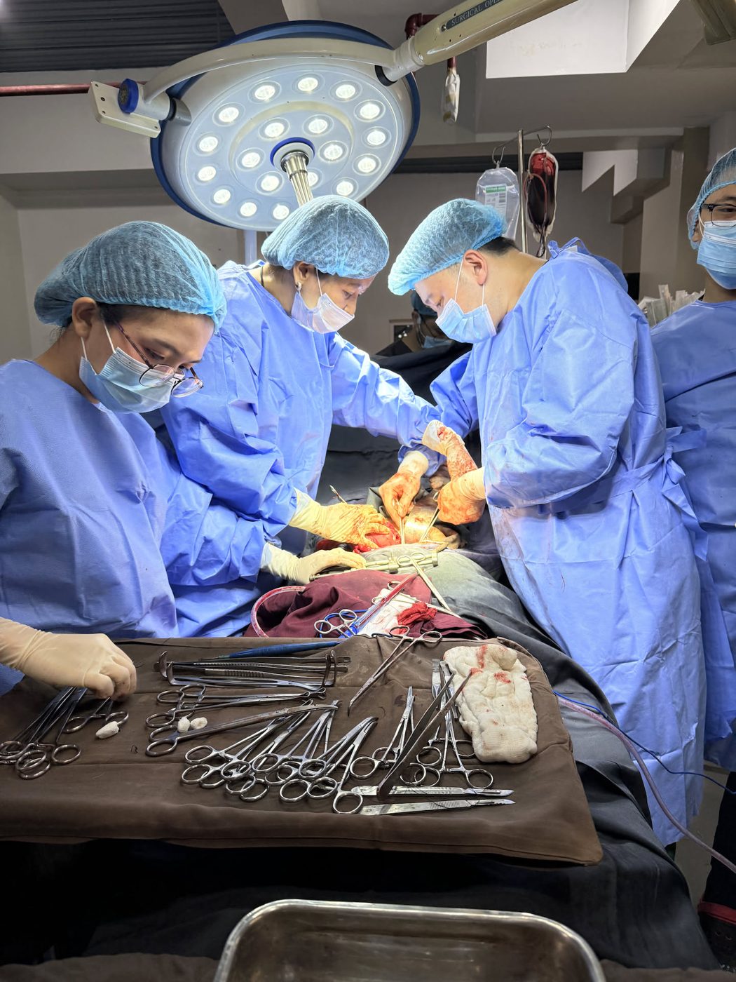 Five-member Holylife surgical team at work